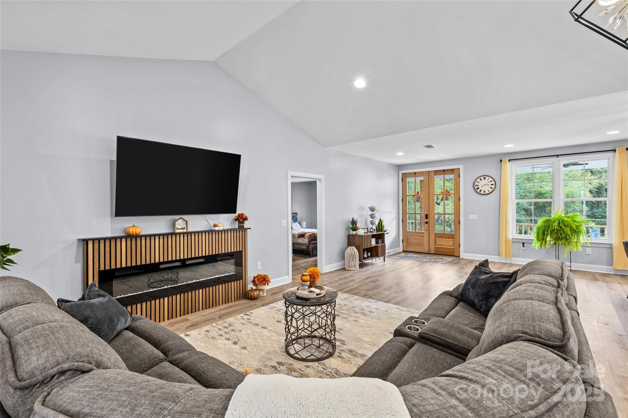 4815 Chadwick Drive Concord, NC 28025 - Photo 18 of 42 a living room with furniture and a flat screen tv