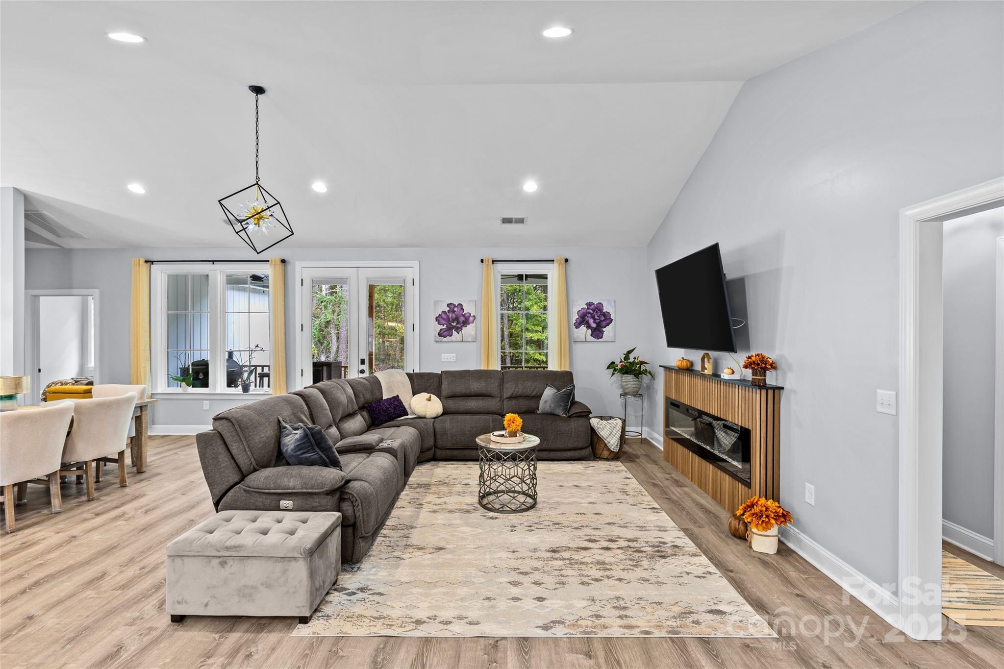 4815 Chadwick Drive Concord, NC 28025 - Photo 19 of 42 a living room with furniture and a flat screen tv