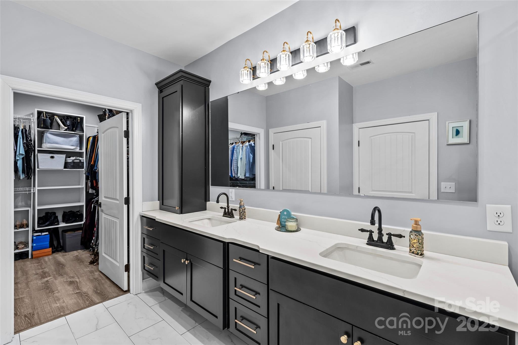 4815 Chadwick Drive Concord, NC 28025 - Photo 24 of 42 a spacious bathroom with a sink double vanity and a mirror