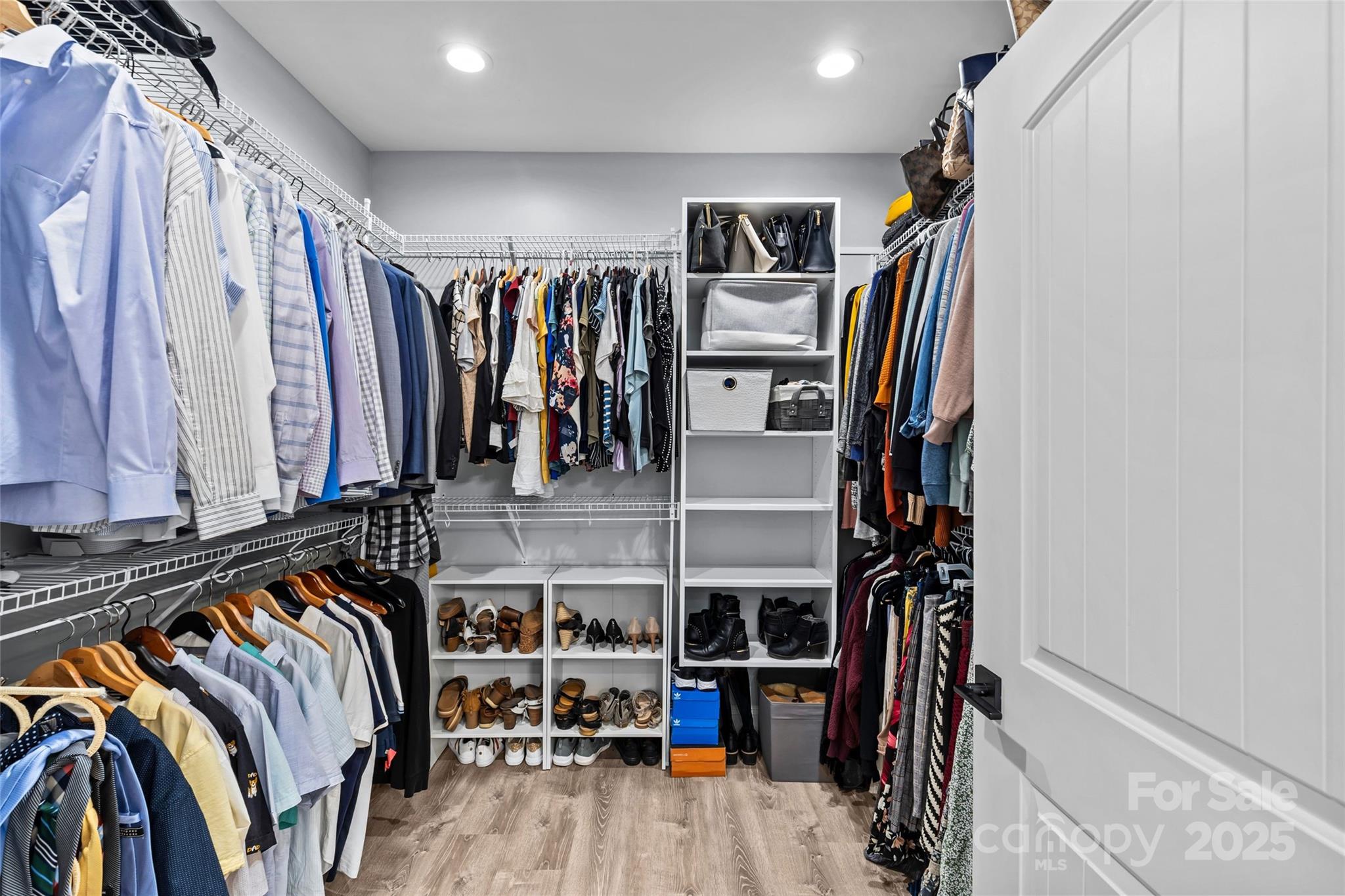 4815 Chadwick Drive Concord, NC 28025 - Photo 25 of 42 a view of walk in closet with clothes and shoes