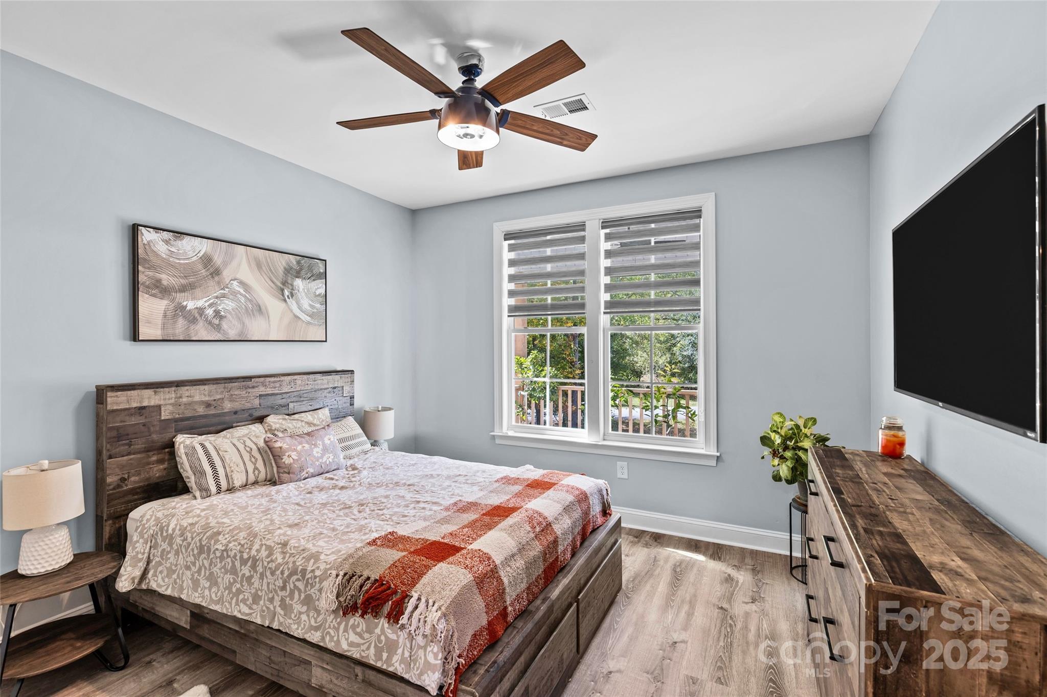 4815 Chadwick Drive Concord, NC 28025 - Photo 26 of 42 a bedroom with a large bed a flat screen tv and a window