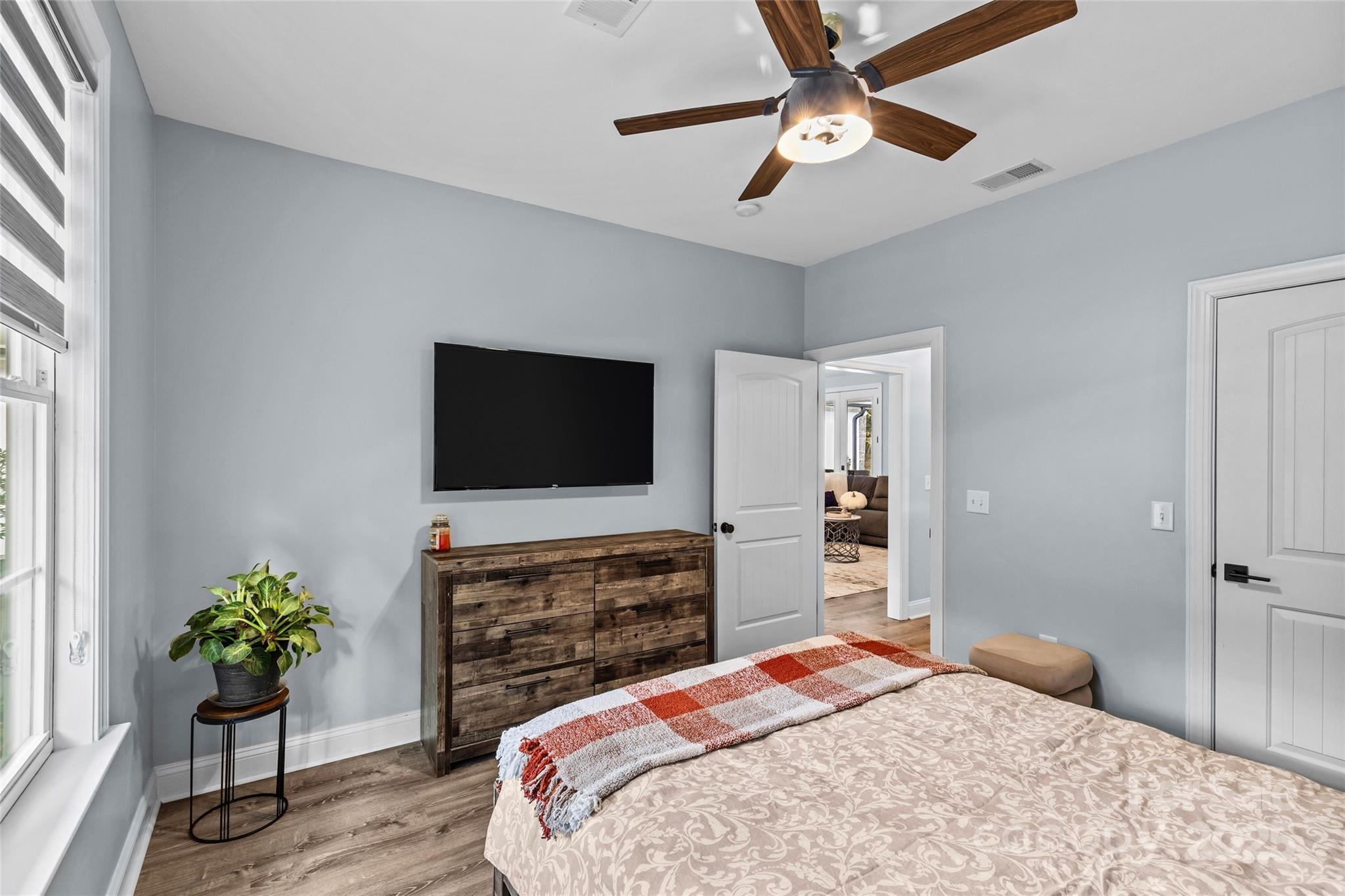 4815 Chadwick Drive Concord, NC 28025 - Photo 27 of 42 a bedroom with a bed and a flat screen tv