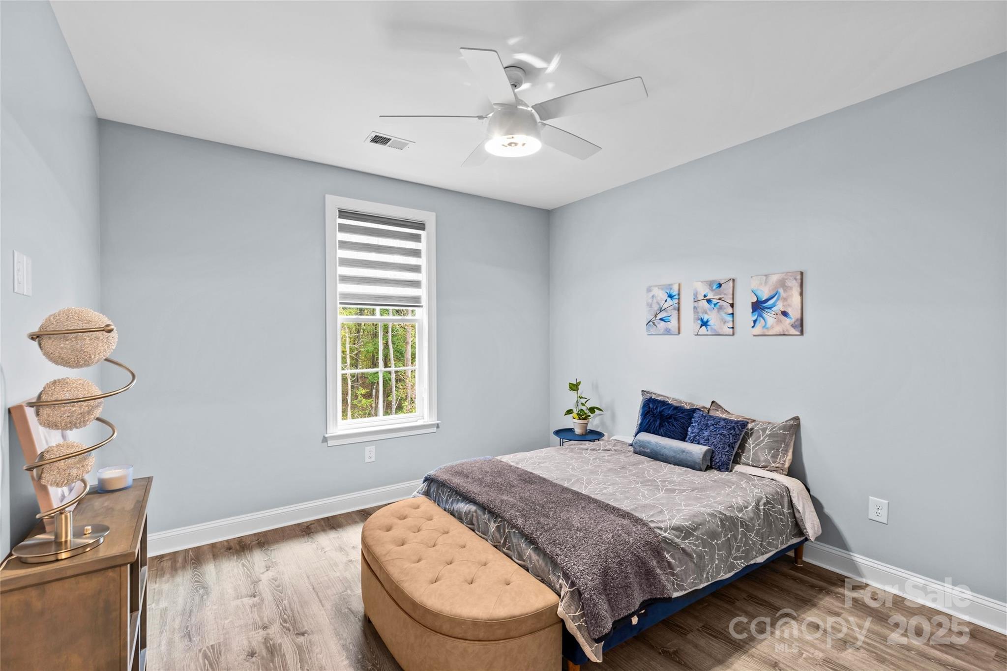 4815 Chadwick Drive Concord, NC 28025 - Photo 29 of 42 a bedroom with a bed and wooden floor