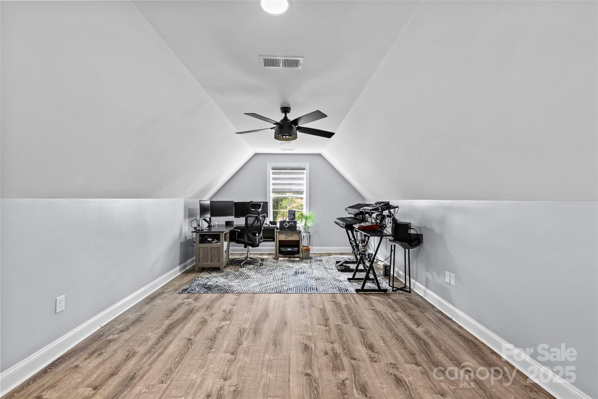 4815 Chadwick Drive Concord, NC 28025 - Photo 32 of 42 a view of a room with wooden floor table and chairs