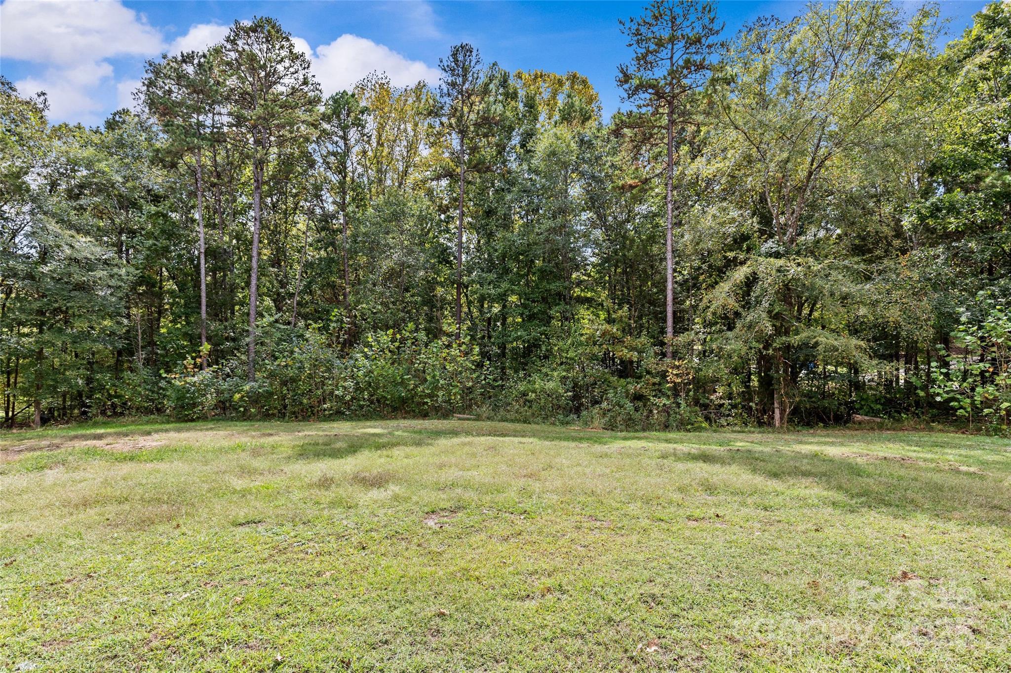 4815 Chadwick Drive Concord, NC 28025 - Photo 42 of 42 a view of a field with trees in the background