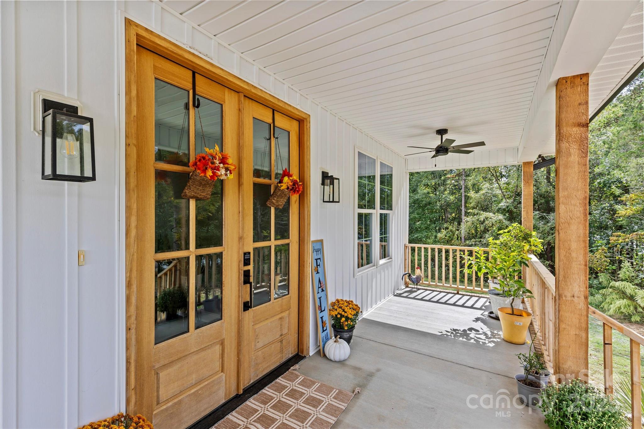 4815 Chadwick Drive Concord, NC 28025 - Photo 5 of 42 a porch with a table and chairs