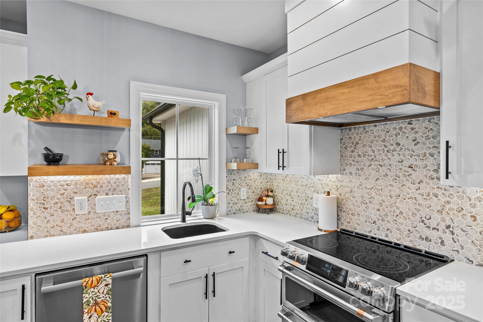 4815 Chadwick Drive Concord, NC 28025 - Photo 8 of 42 a kitchen with a stove and a sink