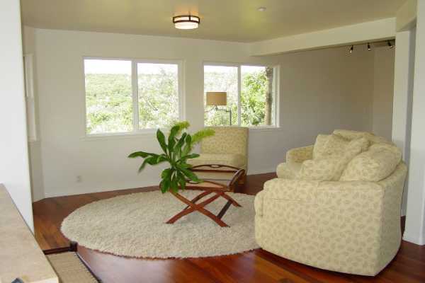 6867 Koolau Road Kilauea, HI 96754 - Photo 5 of 8 a living room with furniture and a potted plant