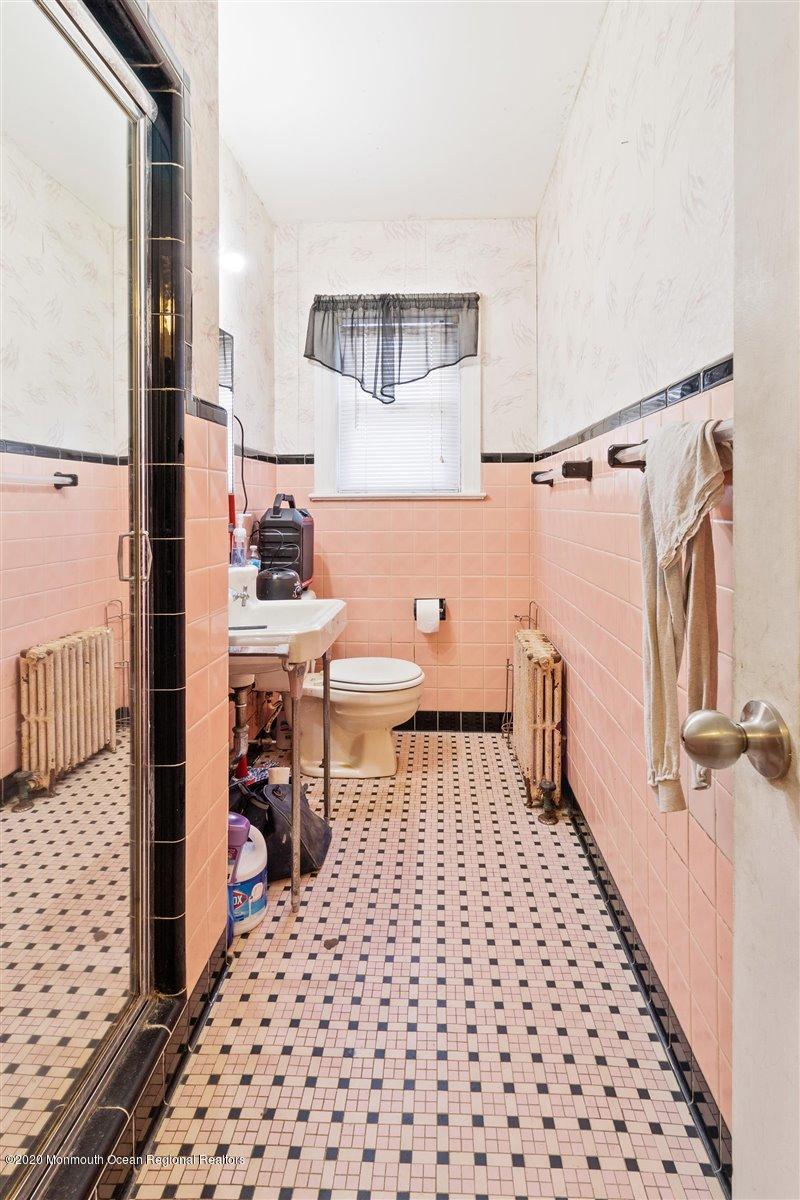 321 Pfister Road Jackson, NJ 08527 - Photo 18 of 30 a bedroom with a bed and a table