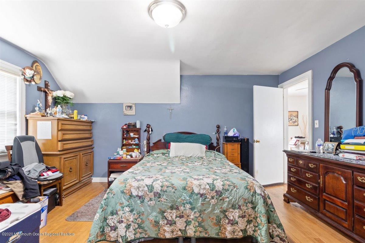 321 Pfister Road Jackson, NJ 08527 - Photo 21 of 30 a bedroom with bed and wooden floor