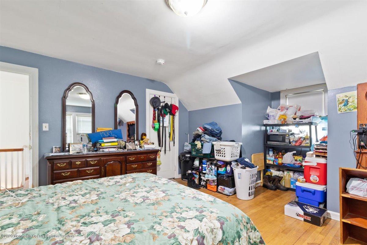 321 Pfister Road Jackson, NJ 08527 - Photo 22 of 30 a bed room with a bed and a large mirror