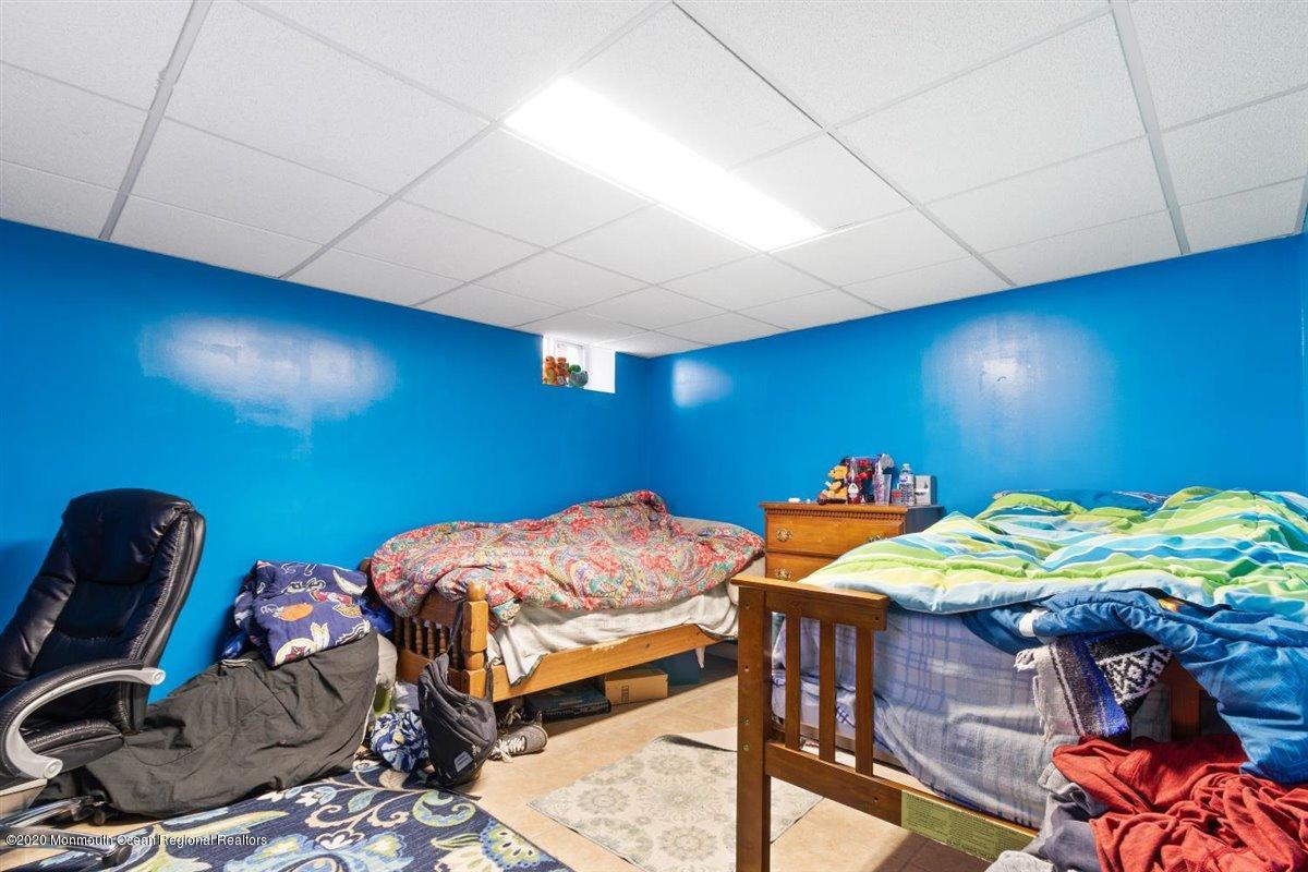 321 Pfister Road Jackson, NJ 08527 - Photo 26 of 30 a bedroom with bed and a mirror