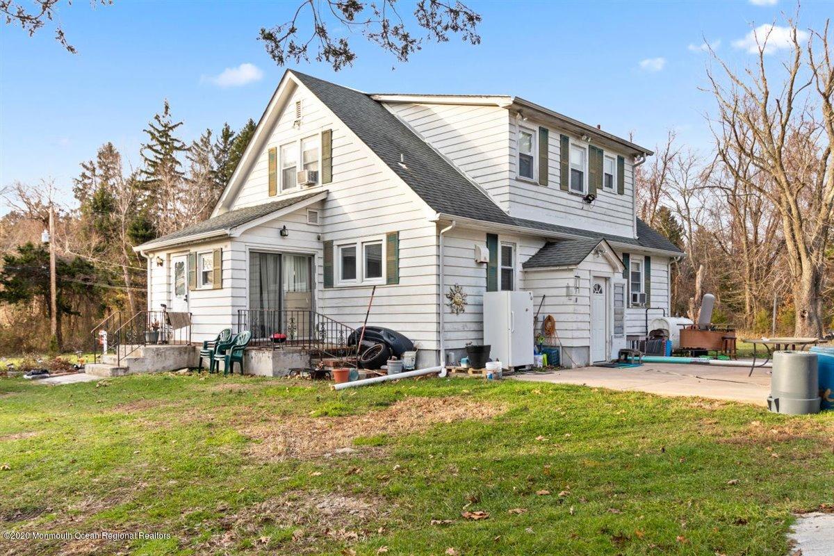321 Pfister Road Jackson, NJ 08527 - Photo 28 of 30 a front view of house with yard and outdoor seating