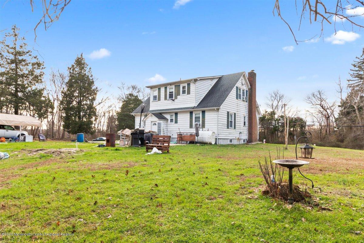 321 Pfister Road Jackson, NJ 08527 - Photo 29 of 30 a front view of a house with garden and porch