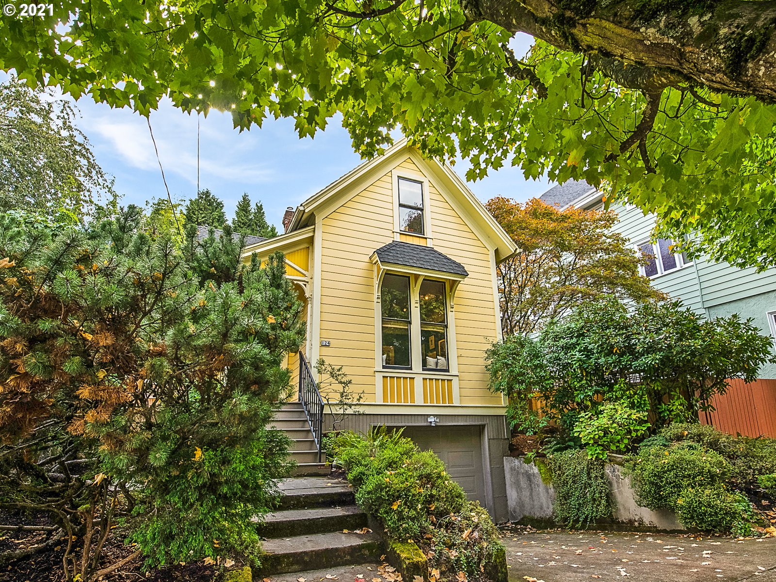124 Southwest Meade Street Portland, OR 97201 - Photo 1 of 32 a view of a house with a tree