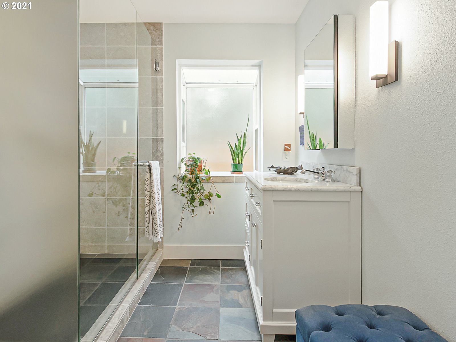 124 Southwest Meade Street Portland, OR 97201 - Photo 18 of 32 a bathroom with a sink a toilet and shower