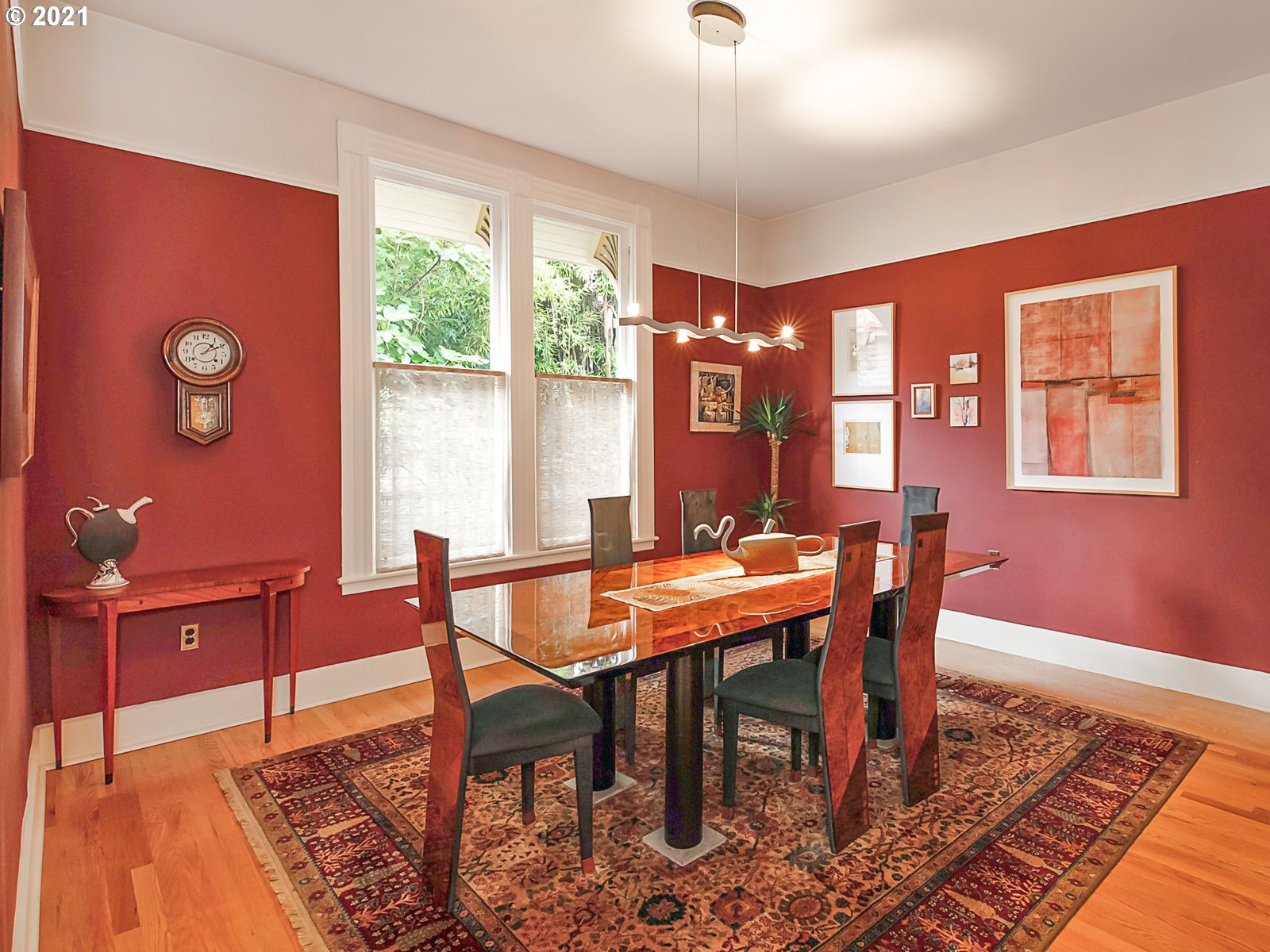 124 Southwest Meade Street Portland, OR 97201 - Photo 8 of 32 a view of a dining room with furniture window and wooden floor