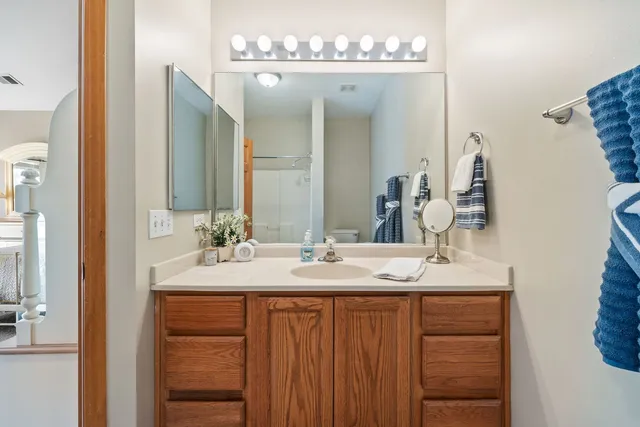 a bathroom with a double vanity sink and a mirror