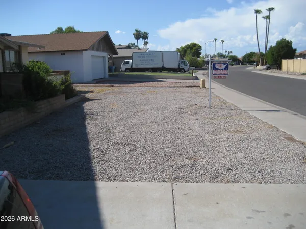 a view of a house with a street