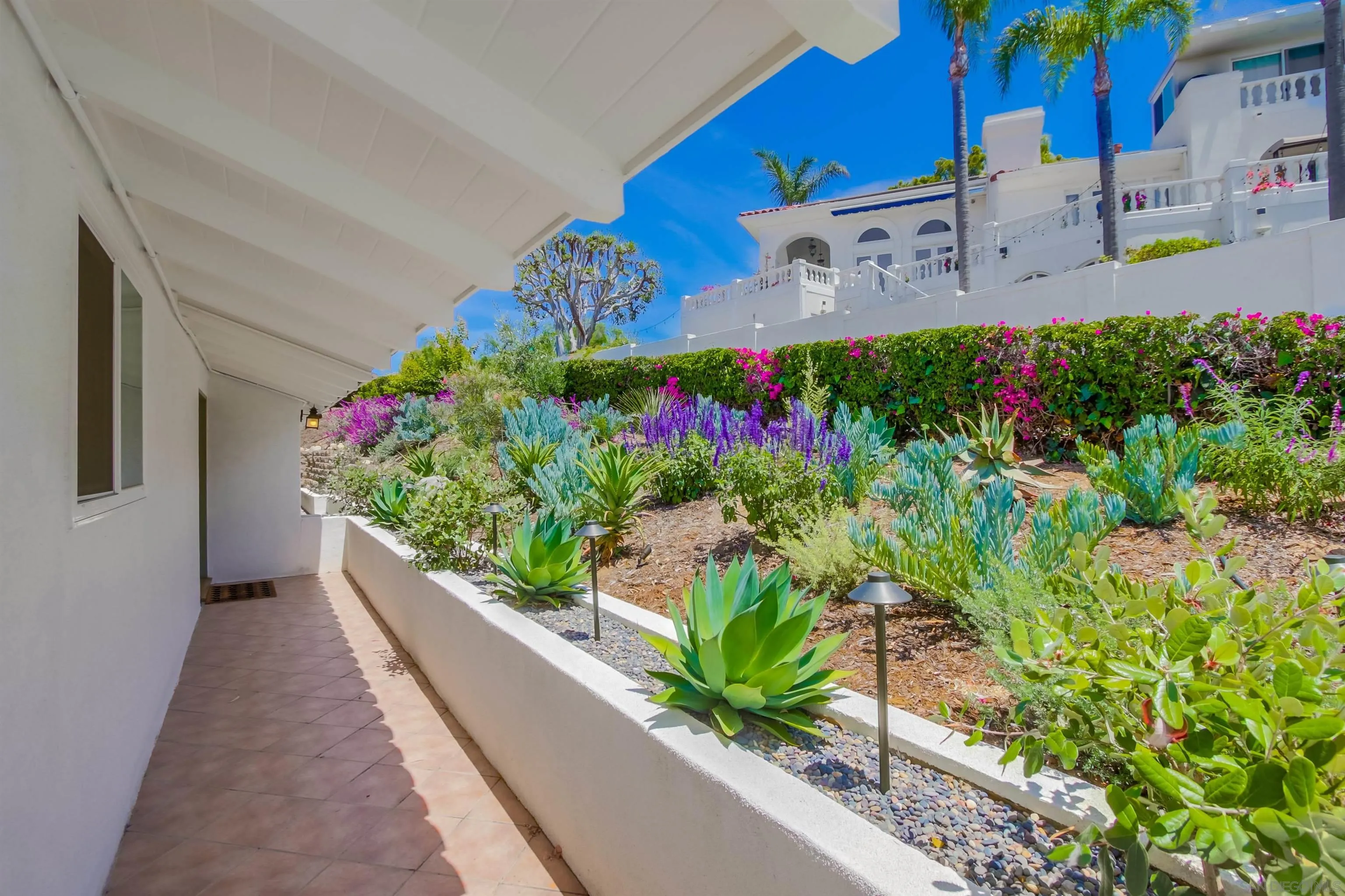 4242 Cosoy Way San Diego, CA 92110 - Photo 22 of 75 a view of a bunch of flowers in a balcony