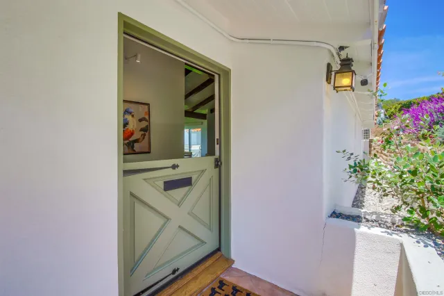 a bathroom with a sink mirror and vanity
