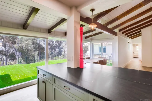 a bathroom with a shower curtain and a shower