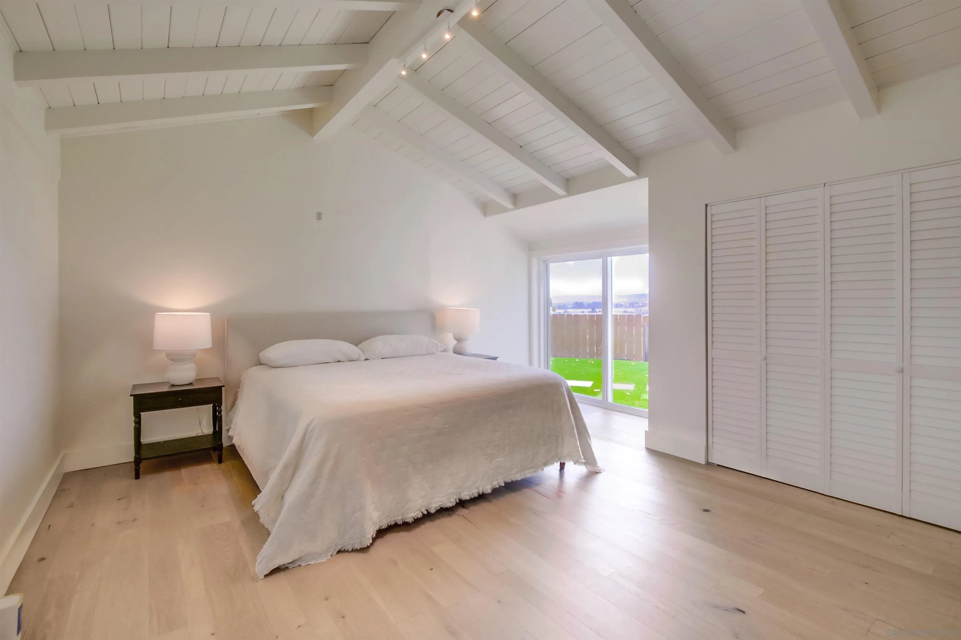 4242 Cosoy Way San Diego, CA 92110 - Photo 25 of 75 a bedroom with a bed and a window