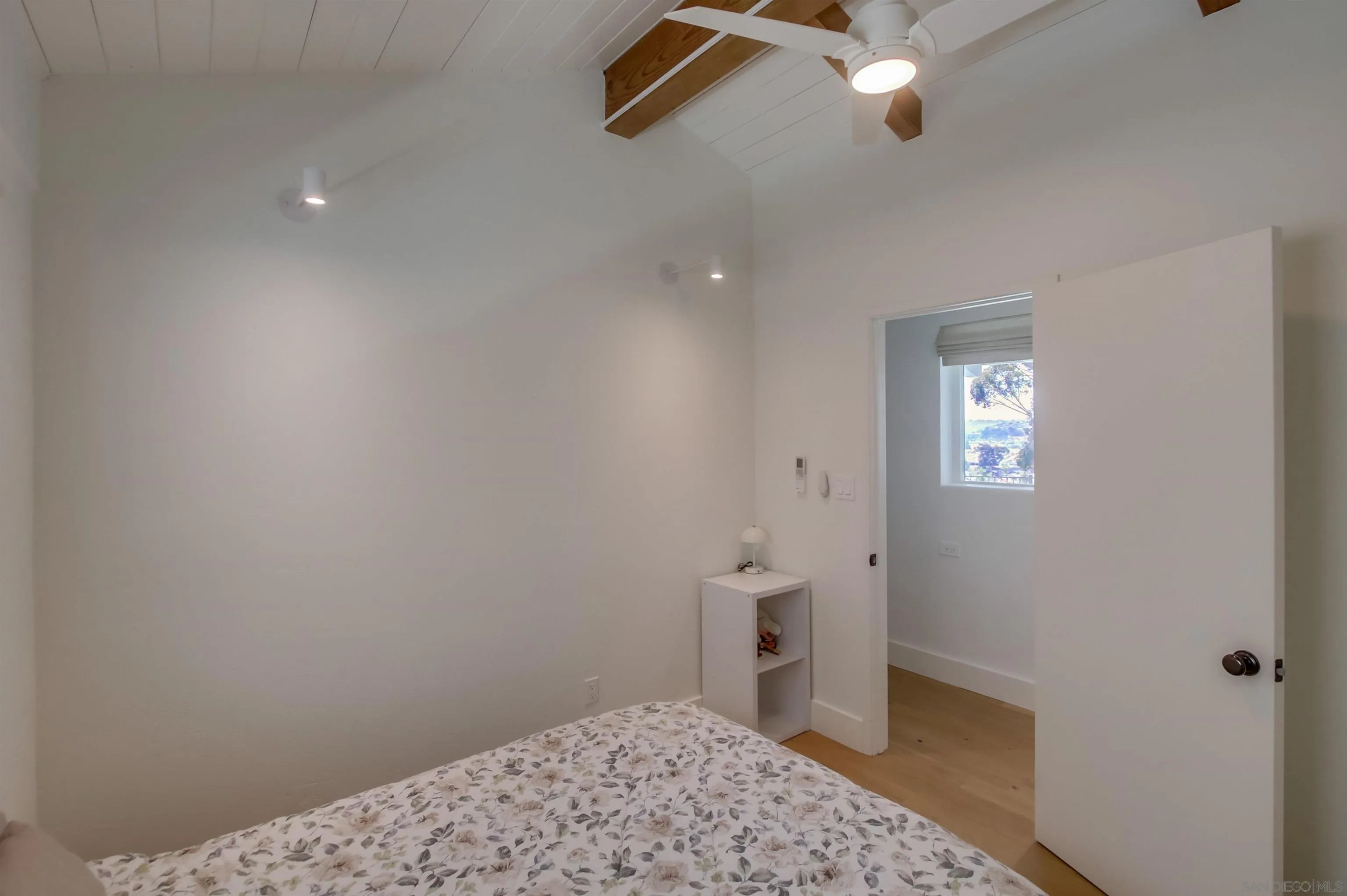 4242 Cosoy Way San Diego, CA 92110 - Photo 38 of 75 a bathroom with a sink a light fixture and a toilet