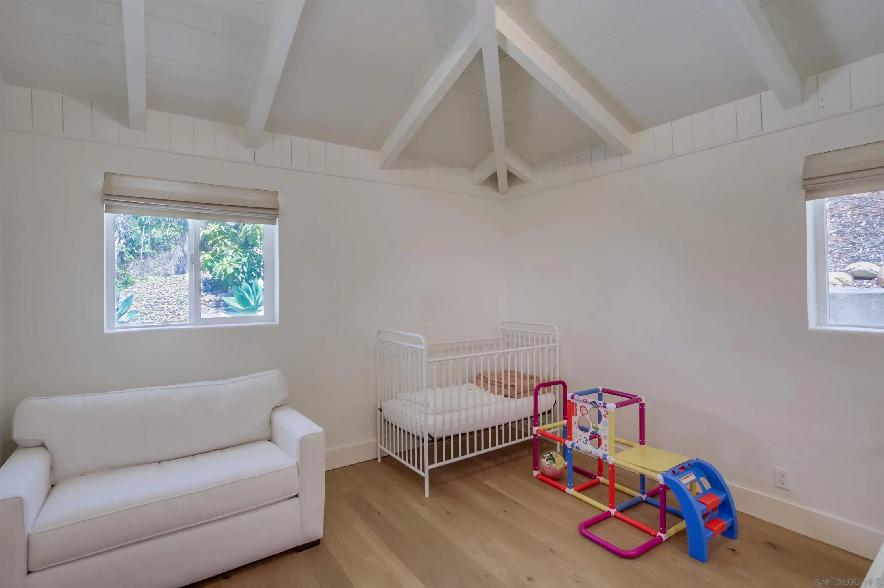 4242 Cosoy Way San Diego, CA 92110 - Photo 39 of 75 a living room with furniture and a wooden floor