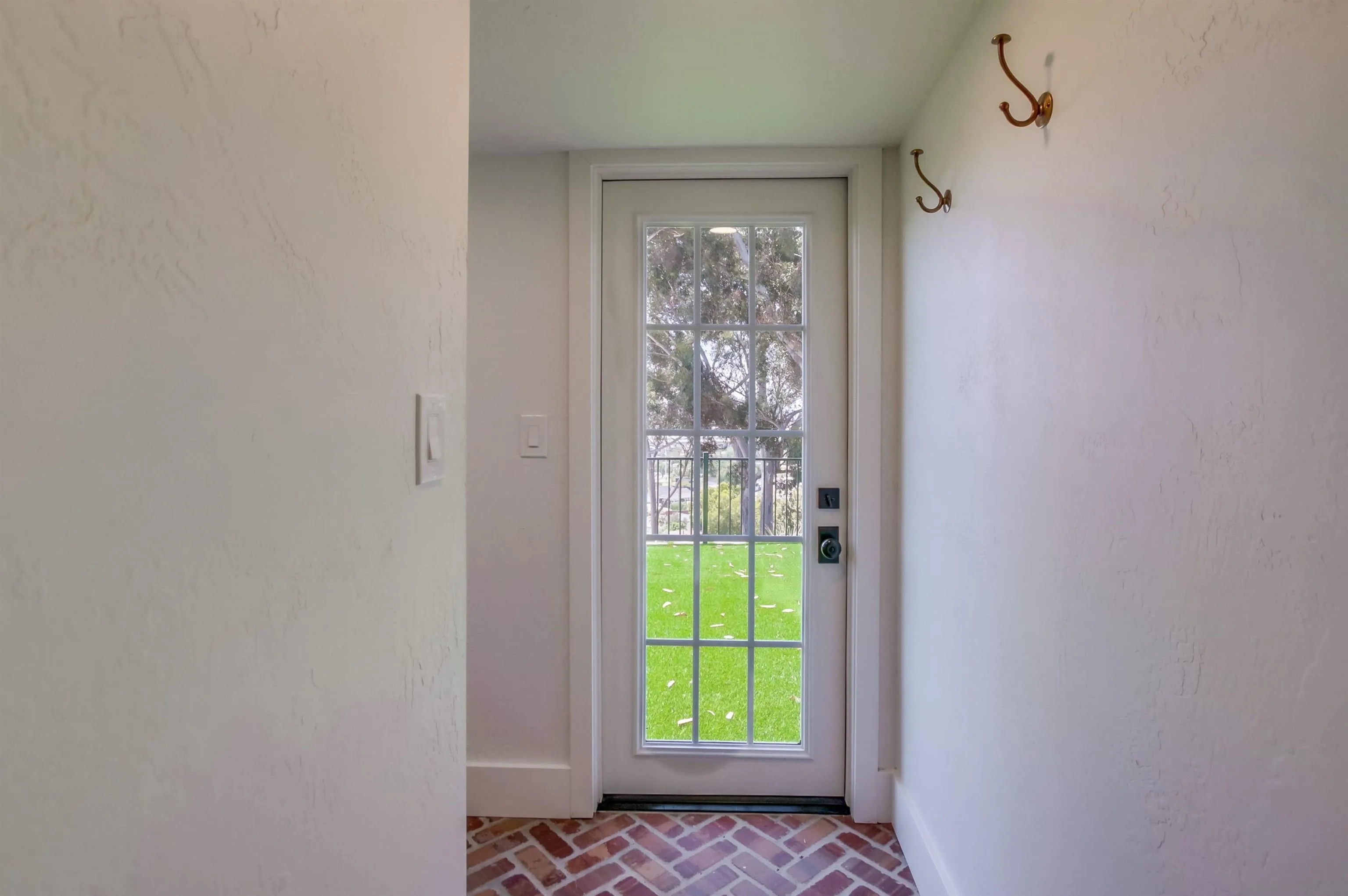 4242 Cosoy Way San Diego, CA 92110 - Photo 42 of 75 a view of an empty room with a window