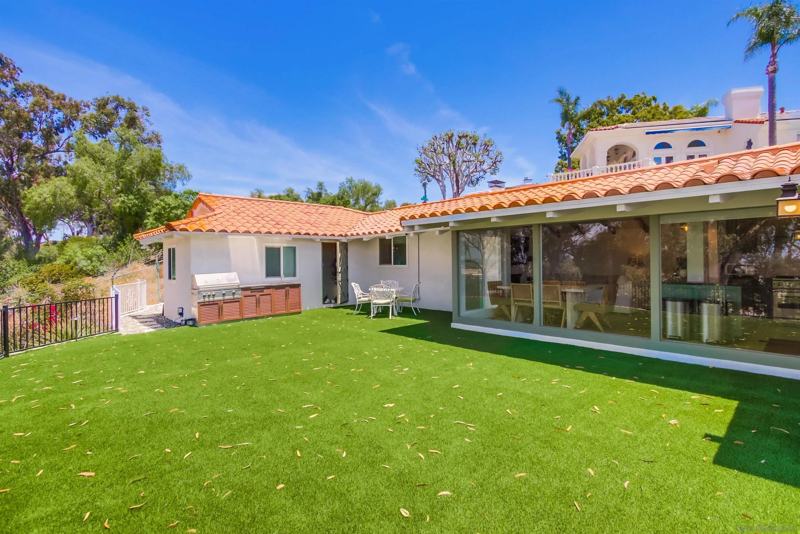 4242 Cosoy Way San Diego, CA 92110 - Photo 48 of 75 a view of a house with a yard porch and sitting area