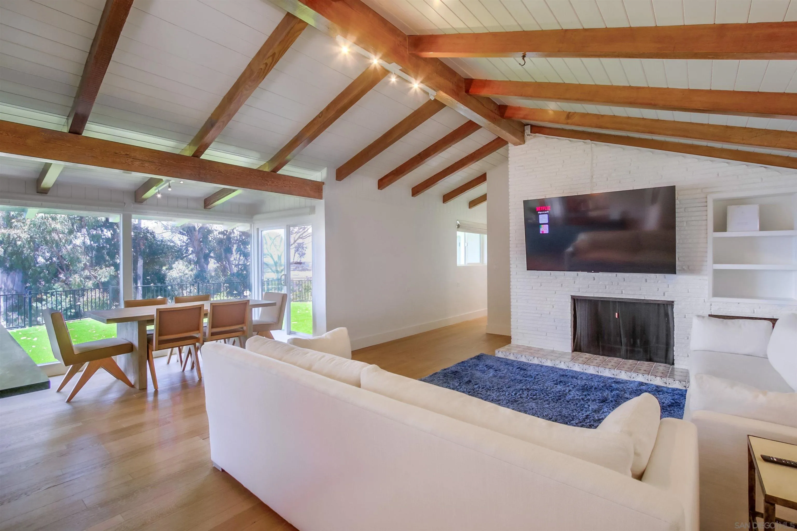 4242 Cosoy Way San Diego, CA 92110 - Photo 5 of 75 a living room with furniture and a fireplace