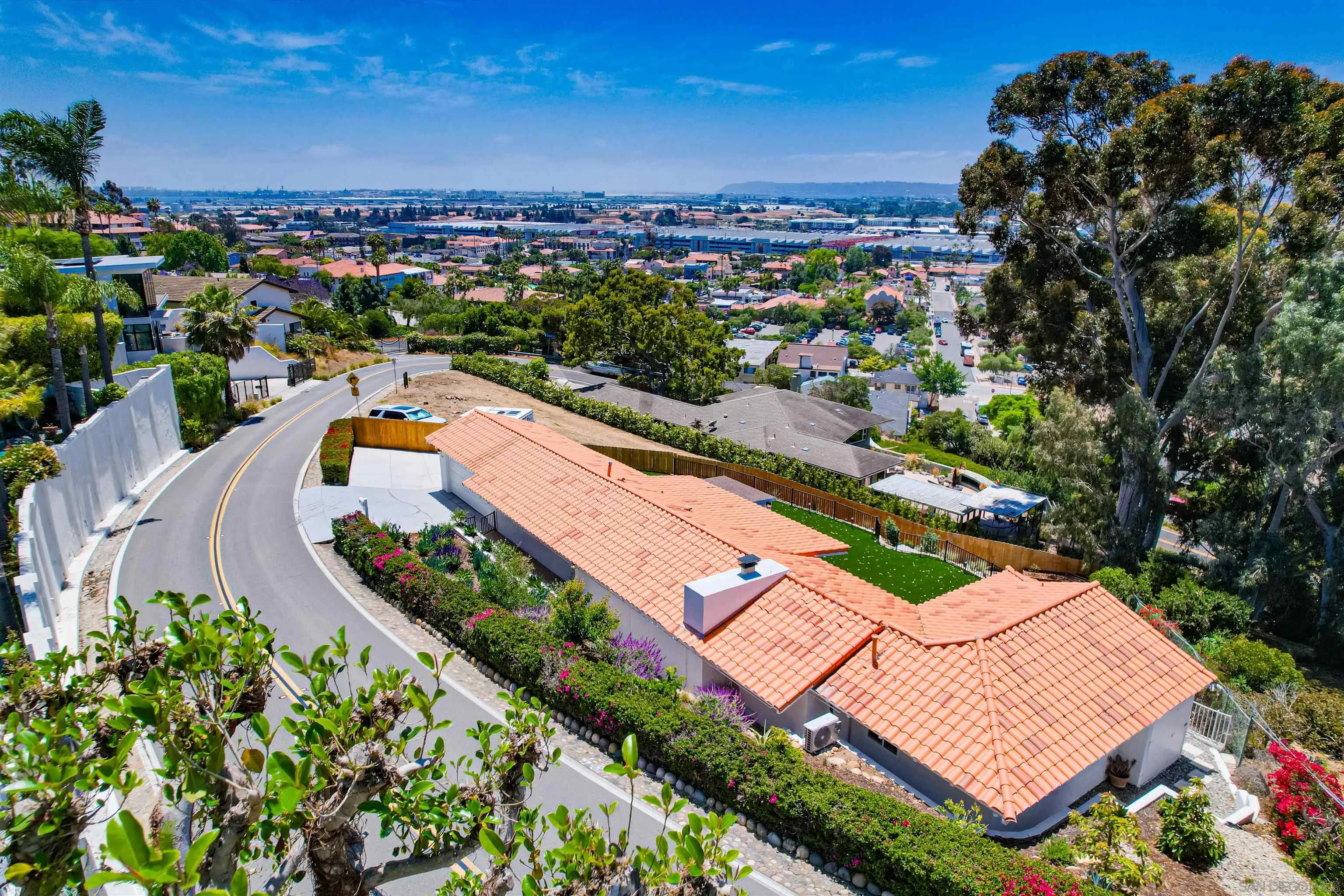 4242 Cosoy Way San Diego, CA 92110 - Photo 60 of 75 an aerial view of a house with a swimming pool yard and lake view