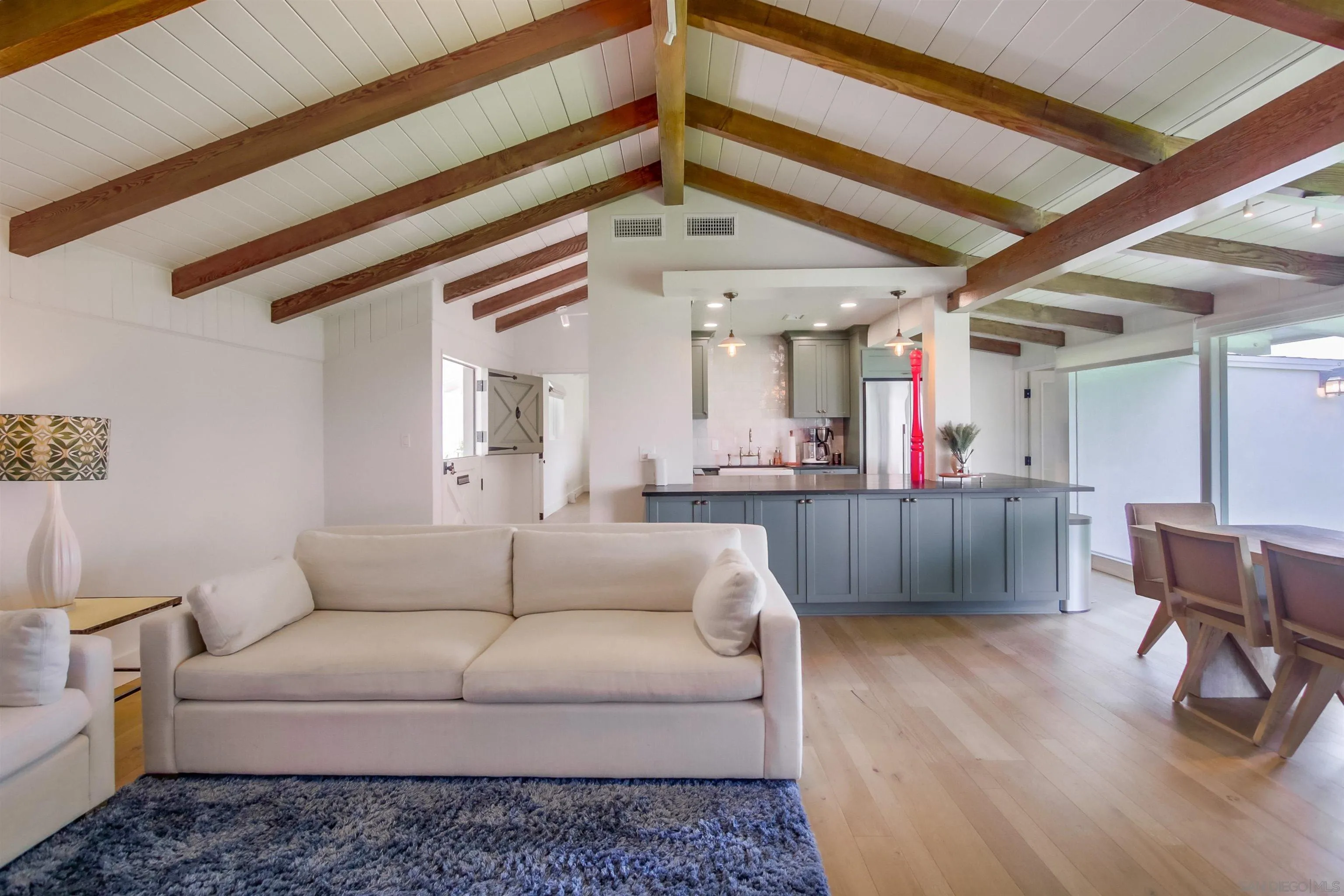 4242 Cosoy Way San Diego, CA 92110 - Photo 6 of 75 a living room with furniture and a chandelier