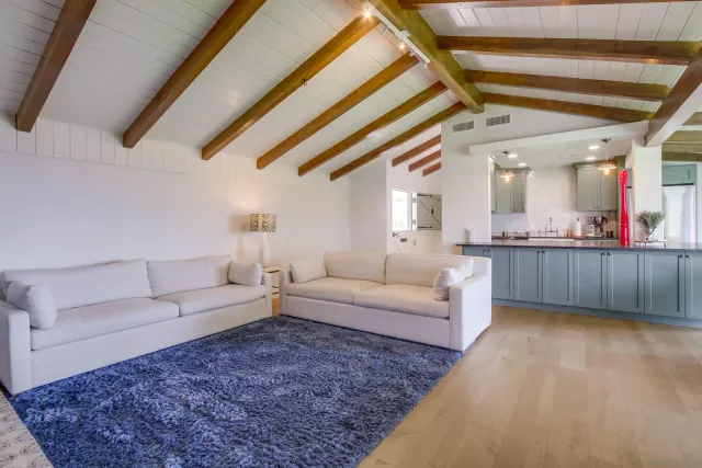 a kitchen with stainless steel appliances granite countertop a sink a stove and a wooden cabinets