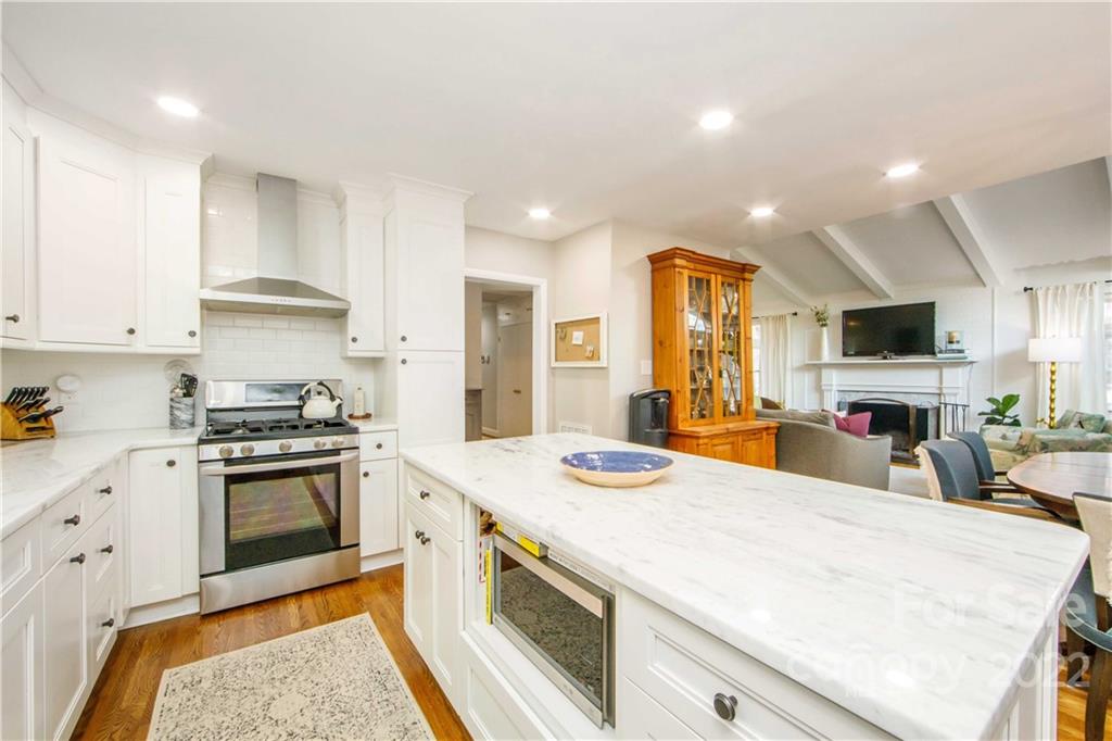 5539 Murrayhill Road Charlotte, NC 28210 - Photo 22 of 46 a kitchen with stainless steel appliances granite countertop a sink and cabinets