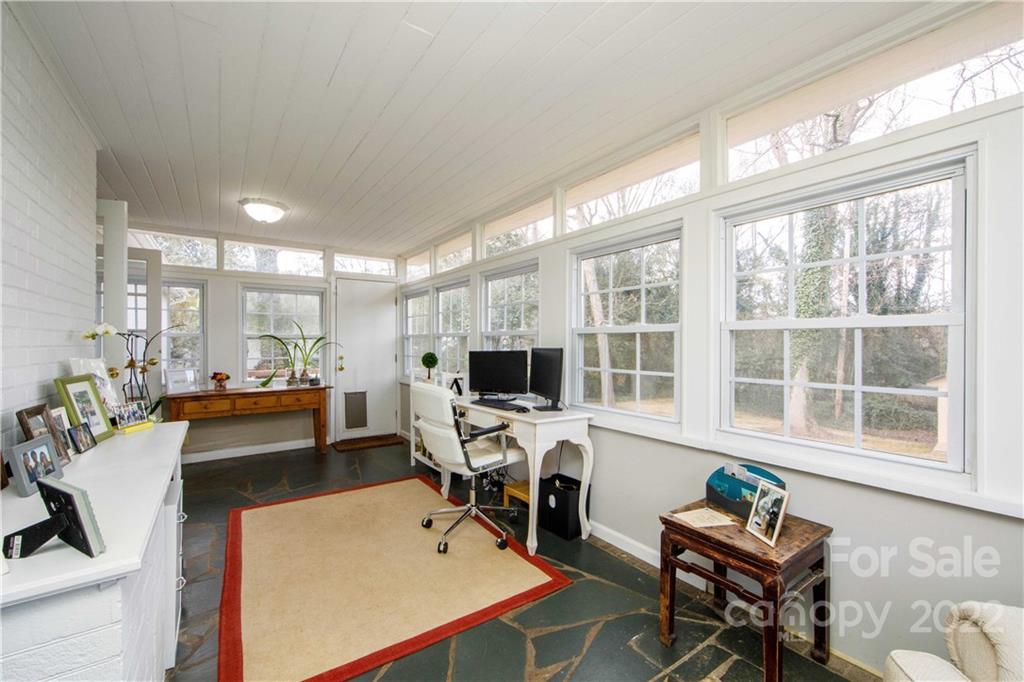 5539 Murrayhill Road Charlotte, NC 28210 - Photo 24 of 46 a view of a workspace with furniture and a large window