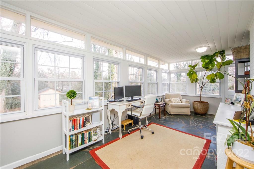 5539 Murrayhill Road Charlotte, NC 28210 - Photo 25 of 46 a living room with furniture a rug a table and a large window