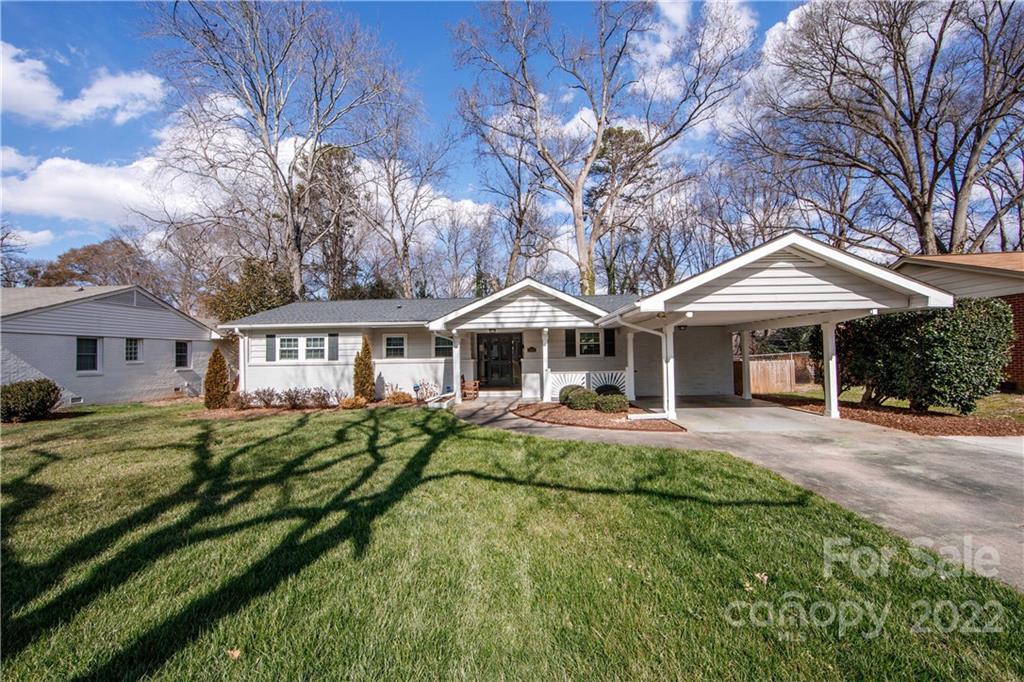 5539 Murrayhill Road Charlotte, NC 28210 - Photo 3 of 46 a front view of a house with a yard table and chairs