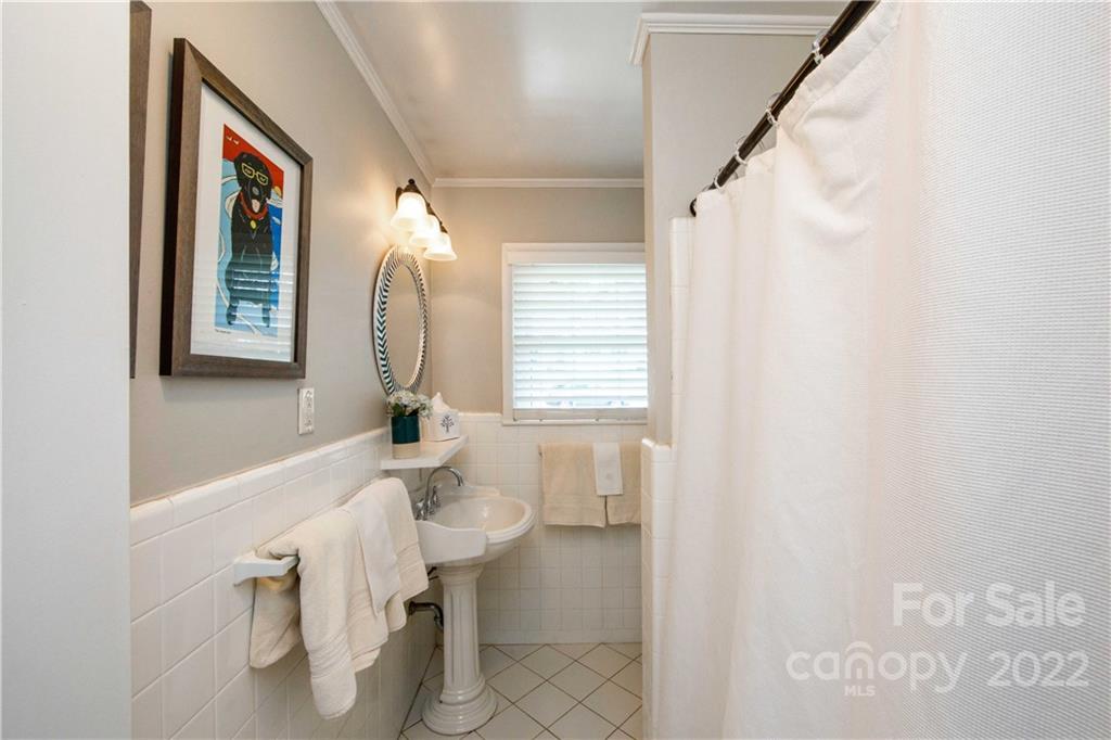 5539 Murrayhill Road Charlotte, NC 28210 - Photo 33 of 46 a bathroom with a sink a toilet and a mirror