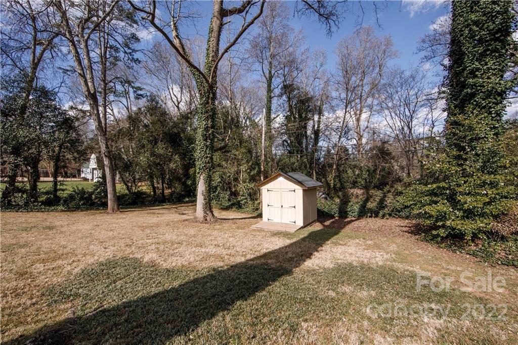 5539 Murrayhill Road Charlotte, NC 28210 - Photo 39 of 46 a view of white house with a yard and tree