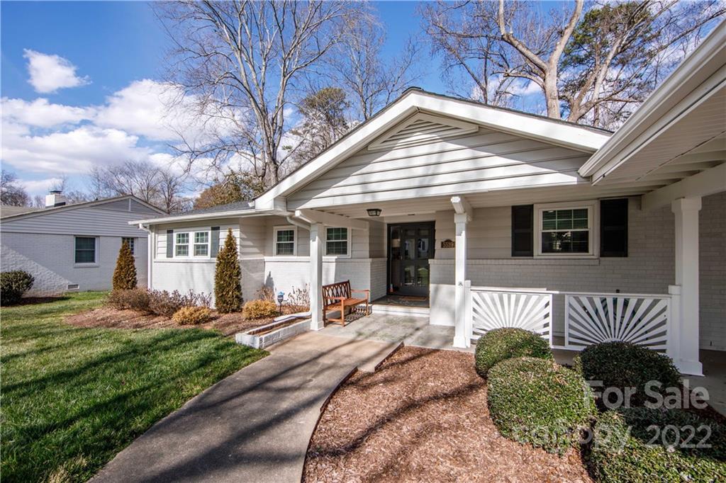 5539 Murrayhill Road Charlotte, NC 28210 - Photo 5 of 46 a front view of a house with a yard outdoor seating and barbeque oven