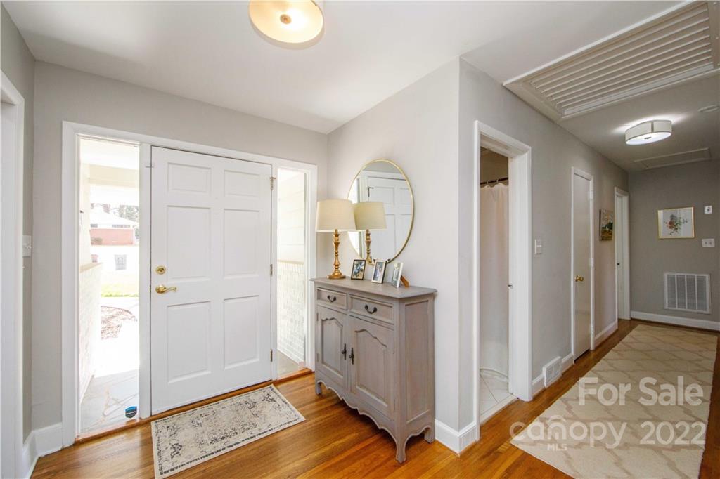 5539 Murrayhill Road Charlotte, NC 28210 - Photo 7 of 46 a view of a hallway with wooden floor