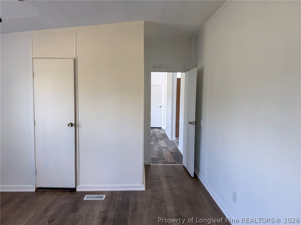 898 Brisson Road St. Pauls, NC 28384 - Photo 17 of 18 a view of a hallway with wooden floor