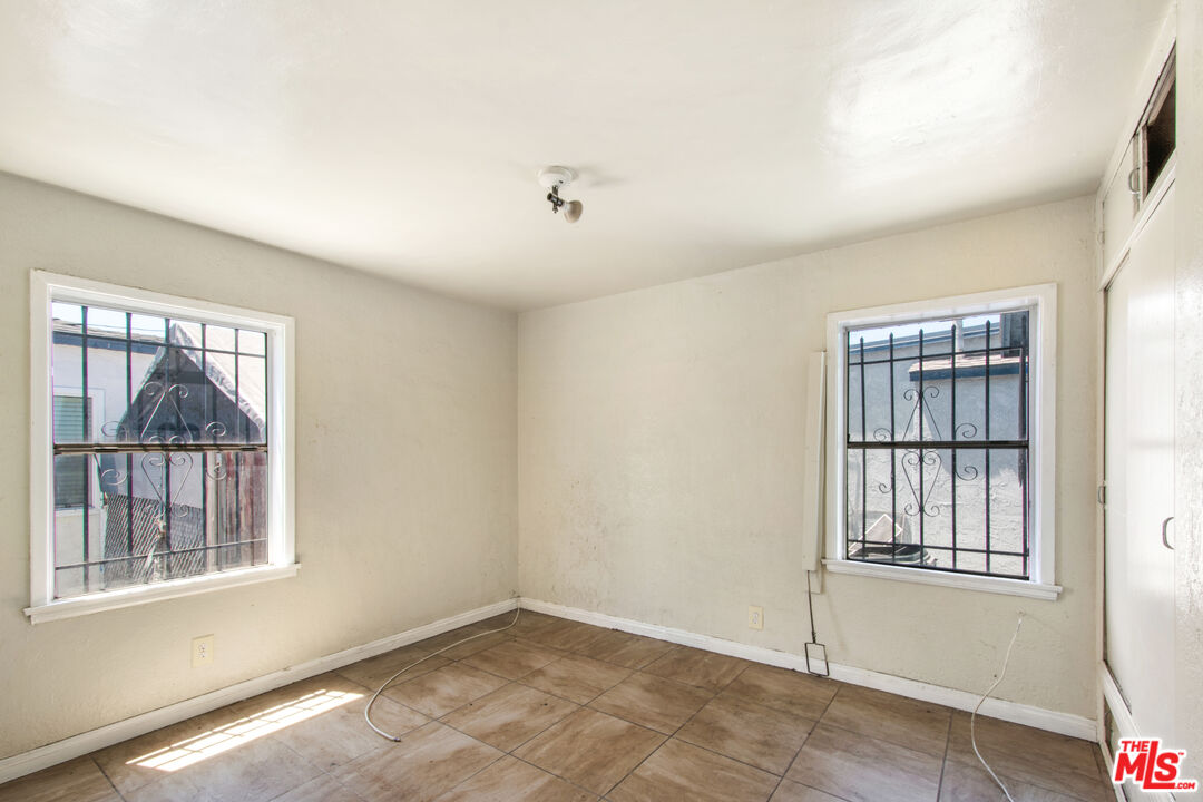 521 South Bullis Road Compton, CA 90221 - Photo 12 of 16 a view of an empty room with a window