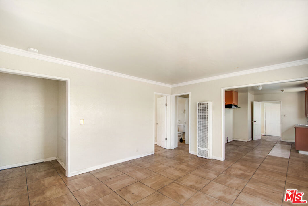521 South Bullis Road Compton, CA 90221 - Photo 5 of 16 a view of a big room with closet and mirror