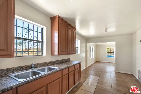 a kitchen with a sink and cabinets