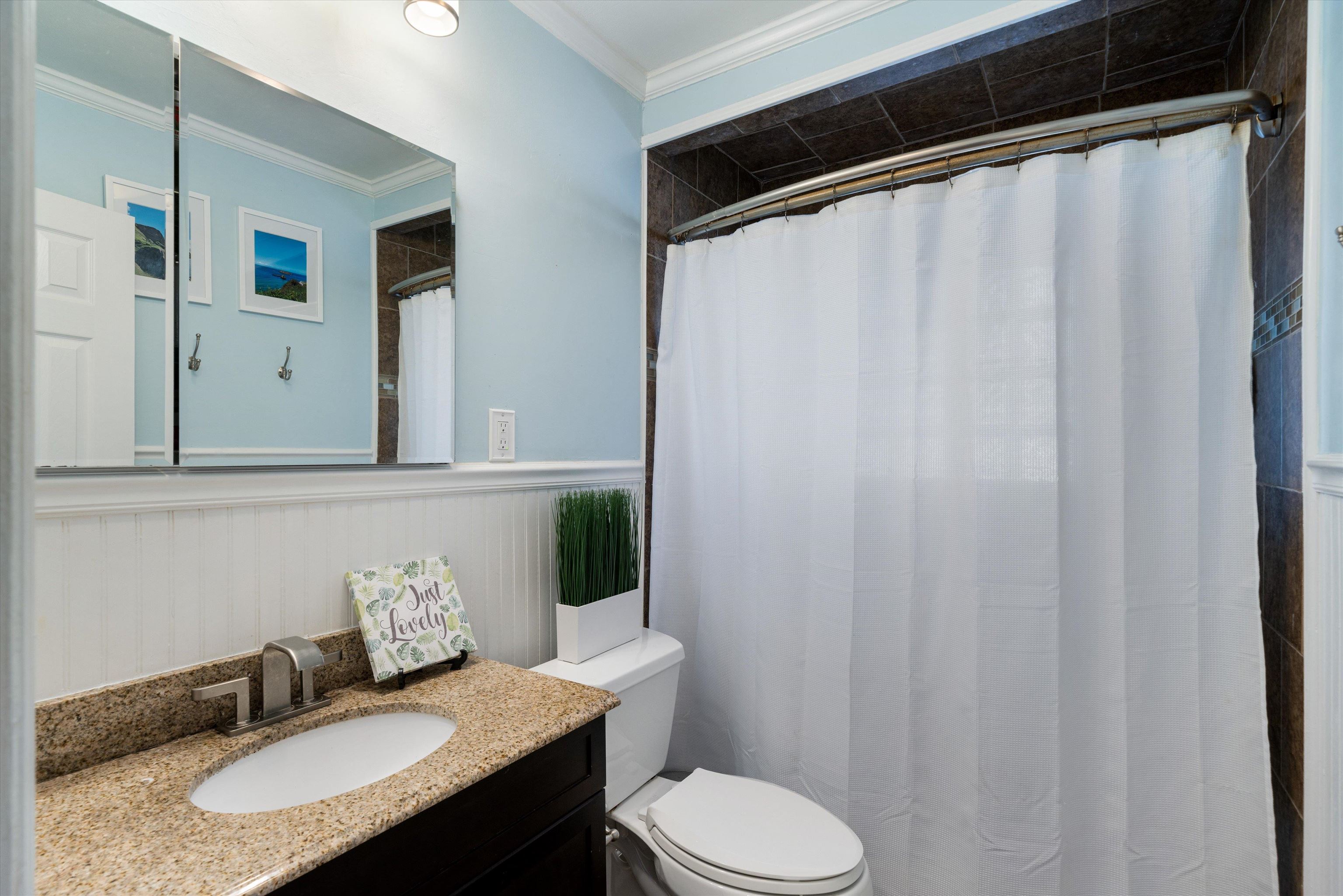 1081 Wilbec Road Memphis, TN 38117 - Photo 11 of 18 a bathroom with a granite countertop sink and a toilet