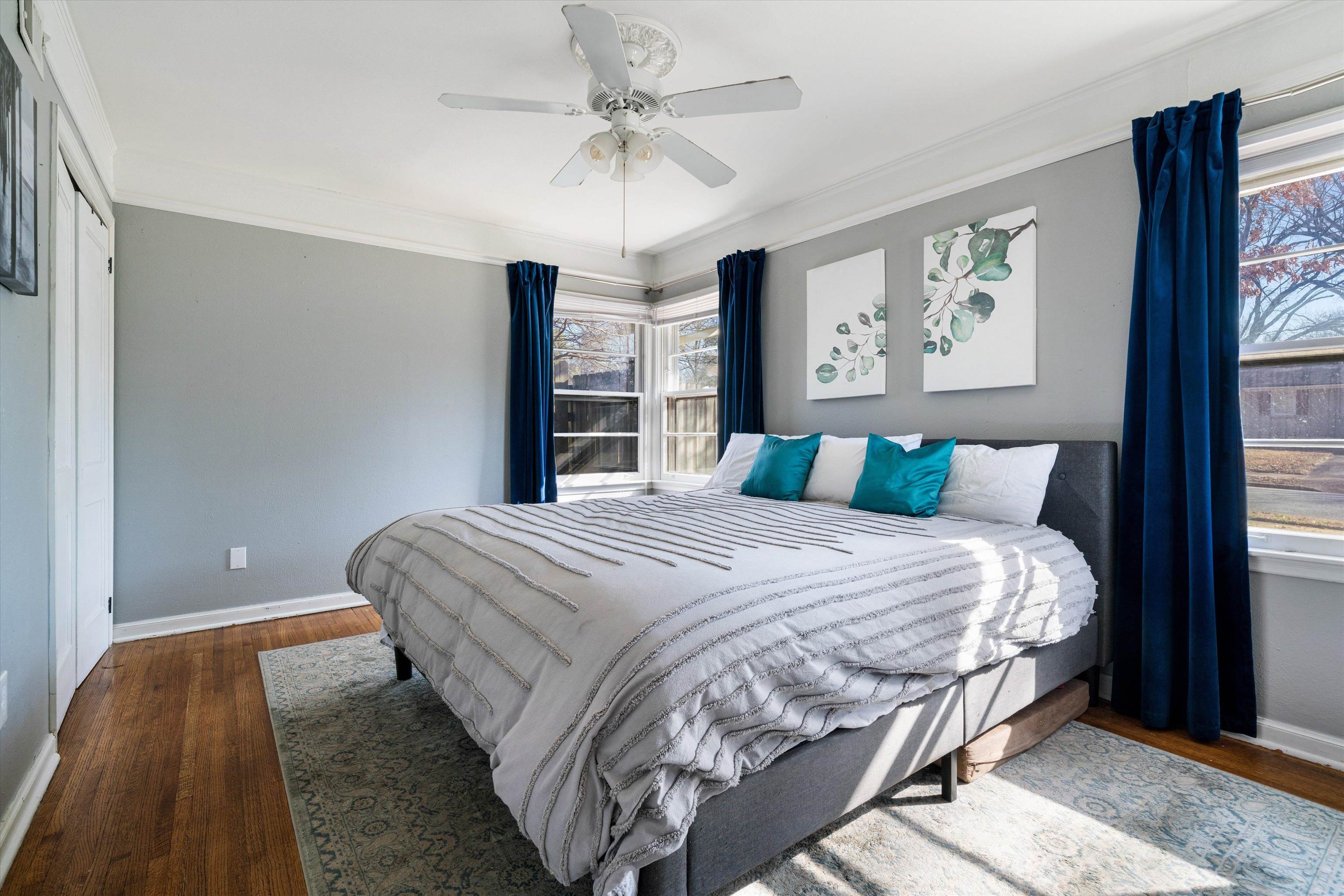 1081 Wilbec Road Memphis, TN 38117 - Photo 12 of 18 a bedroom with a large bed and a chandelier