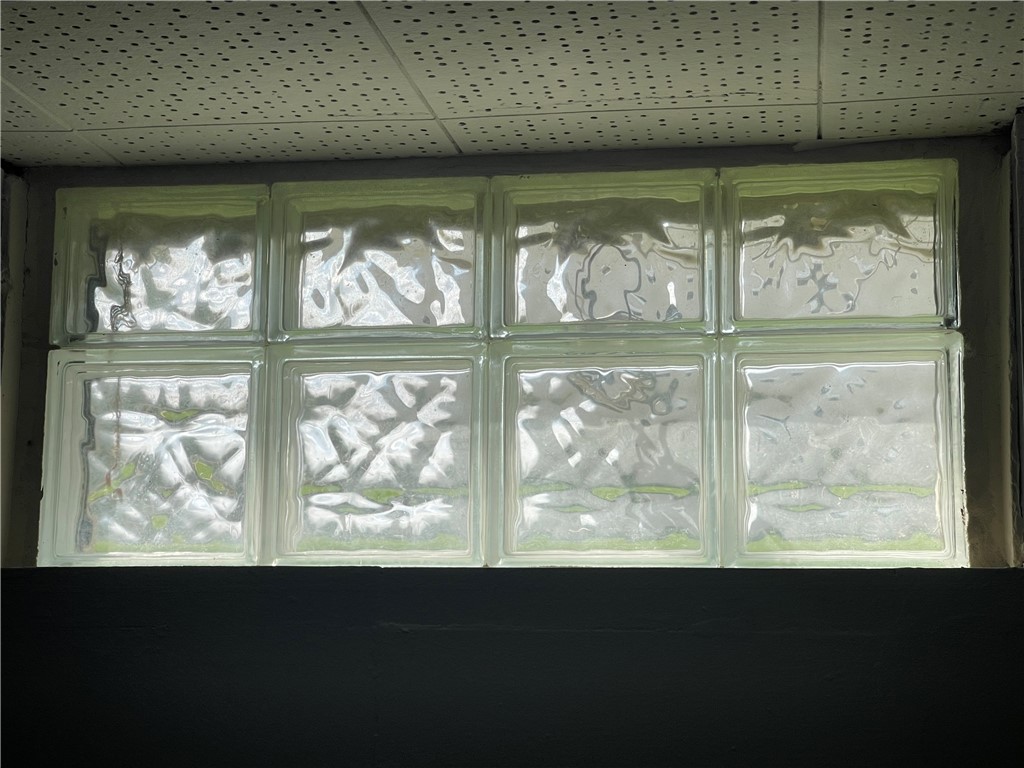 1361 Sussex Road Troy, OH 45373 - Photo 19 of 25 This interior view showcases an elegant glass block window, offering both privacy and abundant natural light.